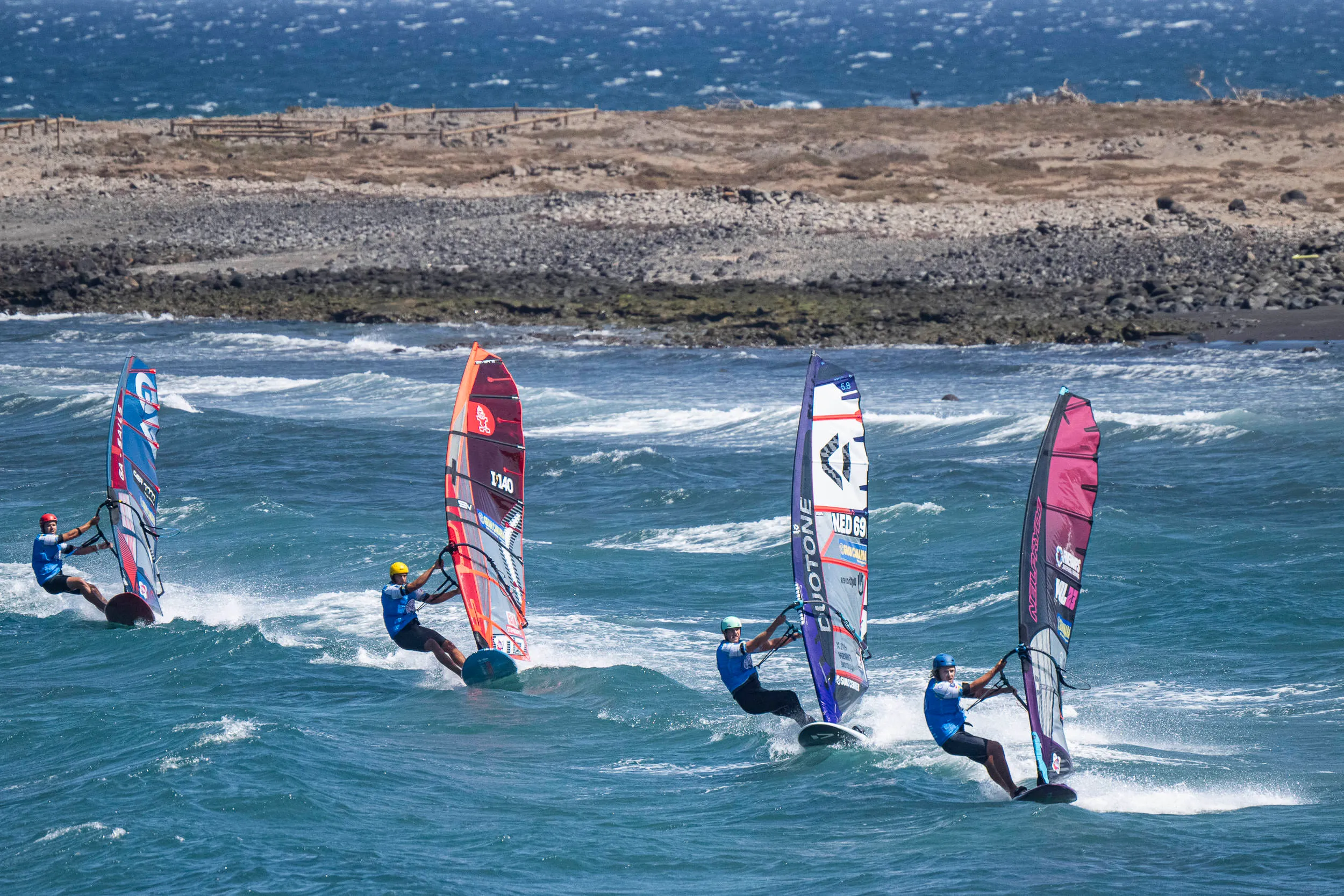 Windsurfers competing in Slalom X at Gran Canaria Gloria Windsurf World Cup.