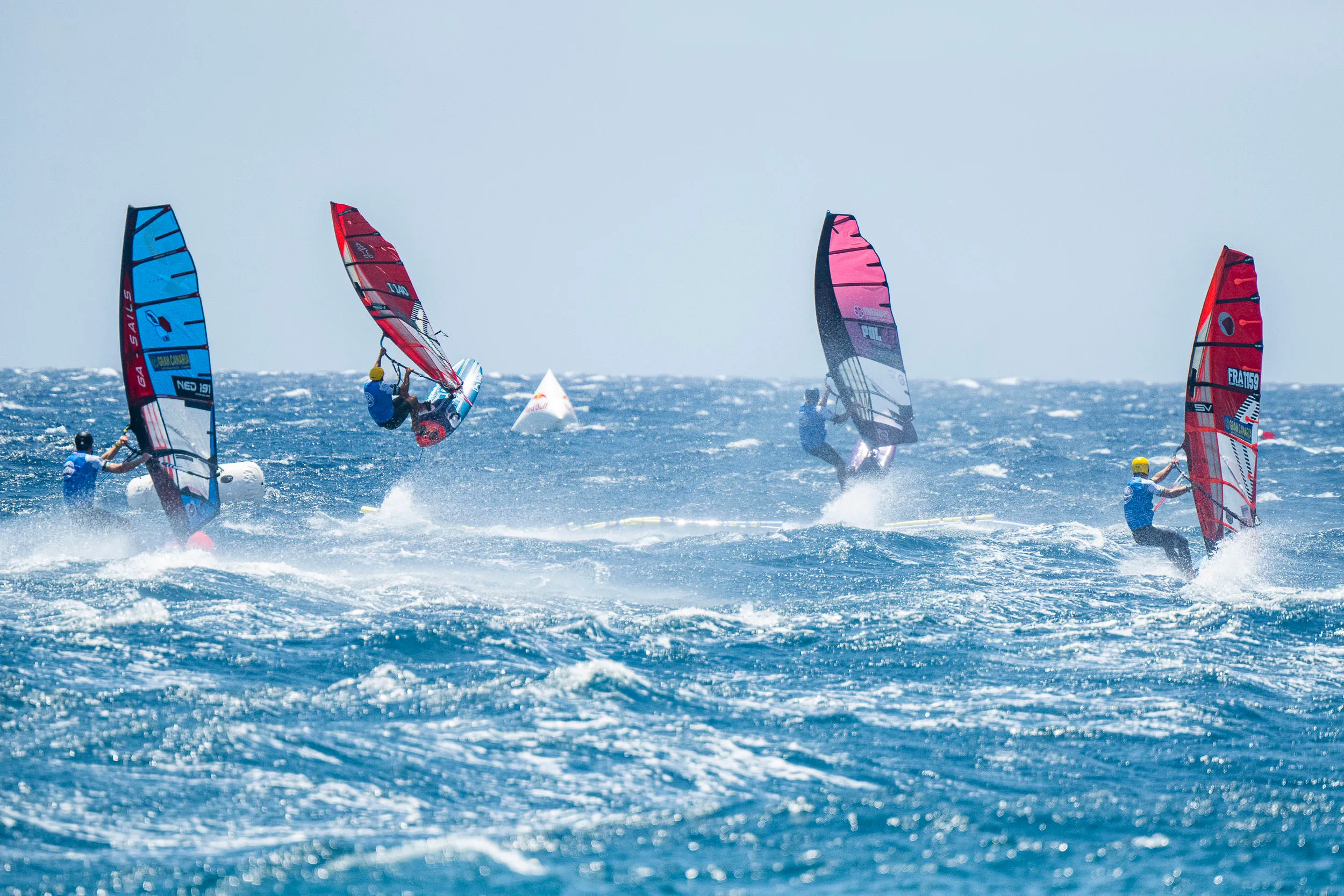 Windsurfers competing in Slalom X at Gran Canaria Gloria Windsurf World Cup.